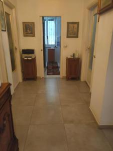 a hallway with a large tile floor in a house at Casa - house Xavier una casa famigliare , dame entra solo Chi a un bel cuore , non'e il l'intero alloggio solo stanze e bagno in Turin