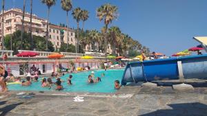 a group of people in a swimming pool at Oneglia Coast Apt in Imperia