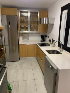 A kitchen or kitchenette at La Minilla Suite