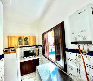Kuchyň nebo kuchyňský kout v ubytování Appartement Beauté Martil