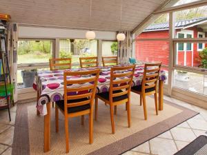 a dining room with a table and chairs at 4 person holiday home in Hemmet in Hemmet