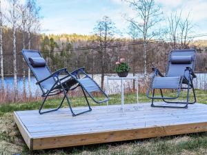 two chairs sitting on top of a wooden deck at 5 person holiday home in BILLINGFORS in Billingsfors