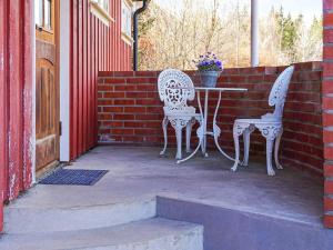 two chairs and a table on a patio at 5 person holiday home in BILLINGFORS in Billingsfors