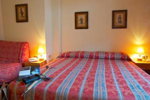 Postel nebo postele na pokoji v ubytování Hotel Dolonne