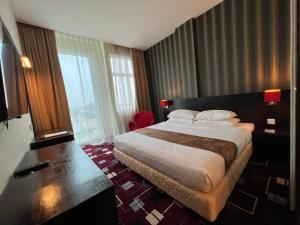 Voodi või voodid majutusasutuse SSL Traders Hotel toas