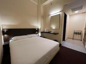Voodi või voodid majutusasutuse SSL Traders Hotel toas