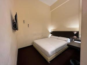 Voodi või voodid majutusasutuse SSL Traders Hotel toas