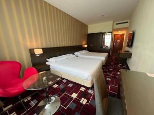 Voodi või voodid majutusasutuse SSL Traders Hotel toas