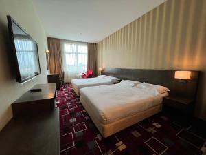 Voodi või voodid majutusasutuse SSL Traders Hotel toas