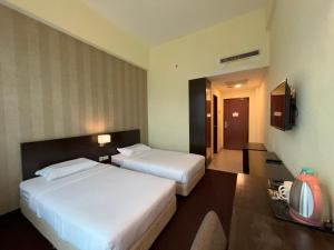 Voodi või voodid majutusasutuse SSL Traders Hotel toas