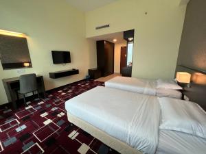 Voodi või voodid majutusasutuse SSL Traders Hotel toas