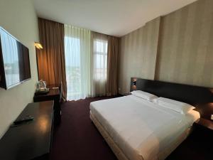Voodi või voodid majutusasutuse SSL Traders Hotel toas