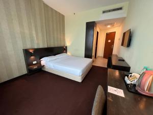 Voodi või voodid majutusasutuse SSL Traders Hotel toas