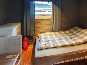 Postel nebo postele na pokoji v ubytování 7 person holiday home in JARFJORD-By Traum
