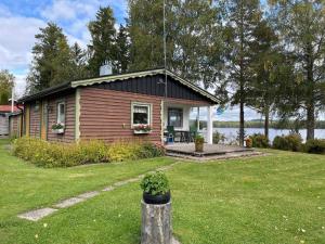 a small house in a yard with a lawn sidx sidx sidx at 4 person holiday home in STORFORS in Storfors