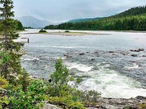 a body of water with trees in the background at 5 person holiday home in TEGEFJ LL in Ängena