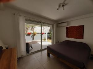 Letto o letti in una camera di Appartement neuf a 150 metres de la mer wifi