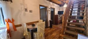 a room with a staircase and a living room at House Old town stone house in Stari Grad