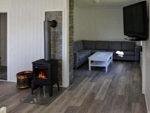 A seating area at 10 person holiday home in Stordal