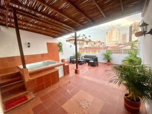 a patio with a hot tub on a building at 4br LUXURY ROOFTOP oldcity AC jacuzzi hottub wifi in Cartagena de Indias