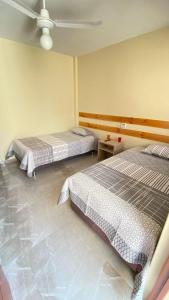 Een bed of bedden in een kamer bij La Posada de Pepe