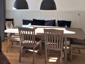 a dining room table and chairs with a table and chairsuggest at 10 person holiday home in S LEN in Stöten