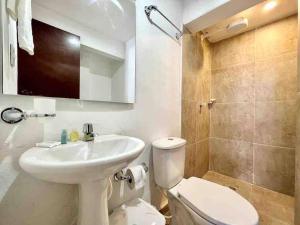 a bathroom with a sink and a toilet and a shower at 5br COZY HOUSE ROOFTOP POOL AC OLD CITY in Cartagena de Indias +23 photos