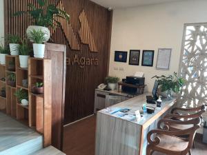 an office with a desk with plants on the wall at Metta Agara in Kerobokan