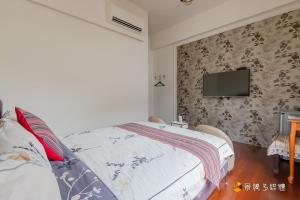 Rúm í herbergi á Atayal Villa