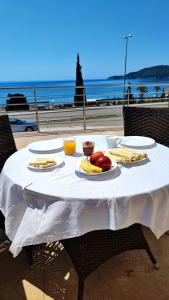 a table with food on it with a view of the ocean at Seaview, just across the beach, Bečići in Bečići