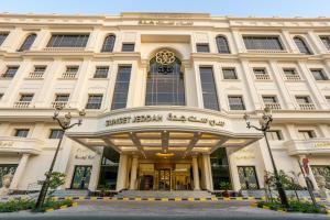 a building with the front of a shopping center at Sunset Jeddah in Jeddah