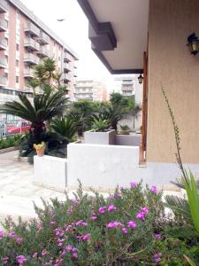 a view of a courtyard with plants and flowers at B&B Al Giardino in Lecce