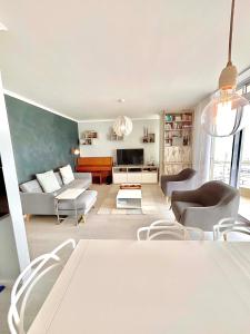 a living room with a couch and a table at 706 Portico in Cape Town