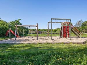 an empty playground with two swings at Holiday home Vestervig XXXIV in Vestervig