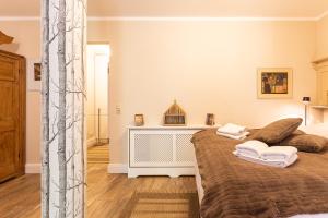 a bedroom with a large bed with two pillows at Christian in Ahrenshoop