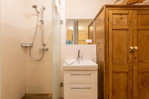 a bathroom with a sink and a shower at Christian in Ahrenshoop +12 photos