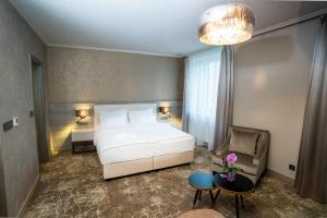 Säng eller sängar i ett rum på HOTEL EUROPA