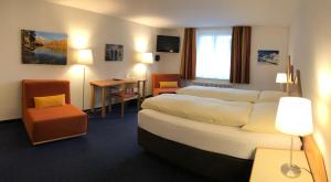 Voodi või voodid majutusasutuse Hotel Weisses Kreuz Bergün toas