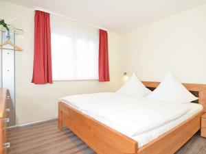 Ein Bett oder Betten in einem Zimmer der Unterkunft Strandhus Sellin - Apt. 02