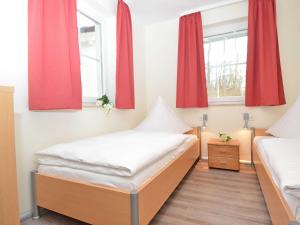 Ein Bett oder Betten in einem Zimmer der Unterkunft Strandhus Sellin - Apt. 02