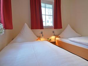 Ein Bett oder Betten in einem Zimmer der Unterkunft Strandhus Sellin - Apt. 02
