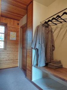 a room with a shelf with clothes on it at EXCLUSIVE HOUSE 400m2 - Sauna, BBQ, fireplace in Narva