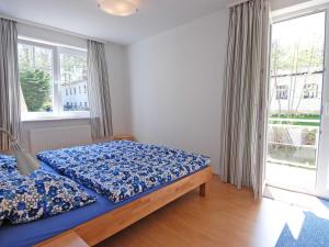 Ein Bett oder Betten in einem Zimmer der Unterkunft Strandwohnungen Sellin - WG04 mit 2 Balkonen