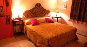 A bed or beds in a room at Cortijo Zalamea