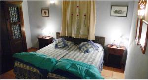 A bed or beds in a room at Cortijo Zalamea