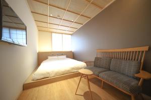 Postel nebo postele na pokoji v ubytování 利々 京都 lili hotel kyoto