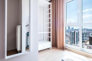a room with a window with a view of a city at Sleek Flat in Kagithane with Terrace in Istanbul