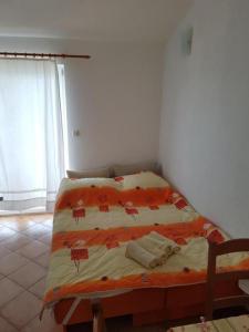 Postel nebo postele na pokoji v ubytování Apartmani Jereb