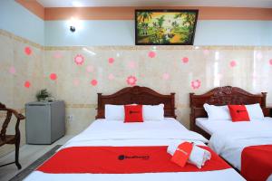 Postel nebo postele na pokoji v ubytování Chin Sao Hotel Nguyen Thi Thap + 16 fotografií
