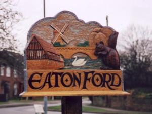 a sign for an eaten ford with a bear and a bird at Whitehouse Holiday Lettings - Luxury Serviced Properties in St Neots, Little Paxton and Great Paxton in Saint Neots